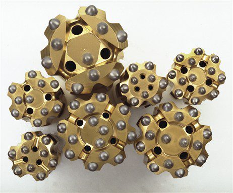 Tungsten carbide button bits and tapered rock drill bits