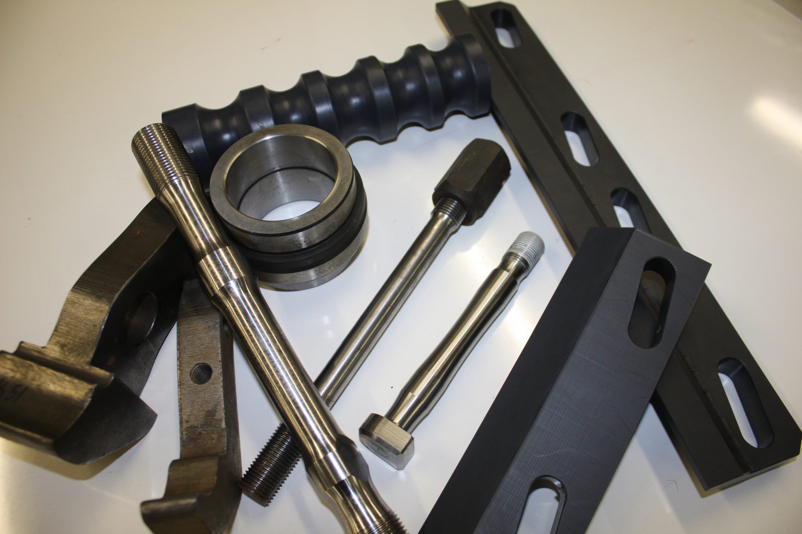 Rock drill bits and extension rods